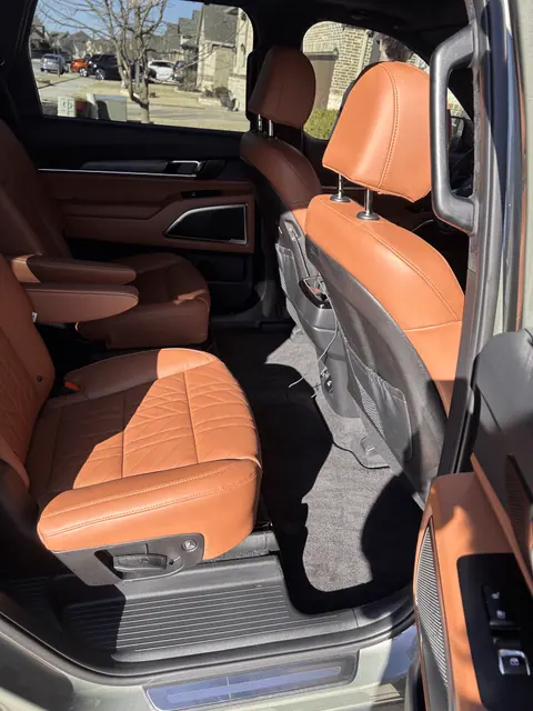 Clean tan leather passenger seating inside a vehicle
